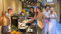 Guests at the hot buffet counter in the Evesham Restaurant