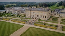 Aerial view of Heythrop Park showcasing its grand mansion and expansive, beautifully landscaped grounds.