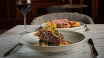 Delicious hot food served in the Brasserie32 with a glass of red wine