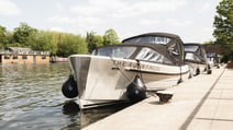 A boat docked on the private jetty at The Runnymede on Thames Hotel