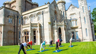 Yoga in front of Studley Castle