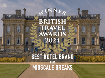 British Travel Award Best Hotel for Midscale Breaks award logo over a photo of Heythrop Park Hotel