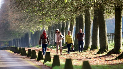 Guests walking through the grounds at Littlecote House