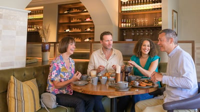 A group of guests dining at The Travelling Duke at Heythrop Park