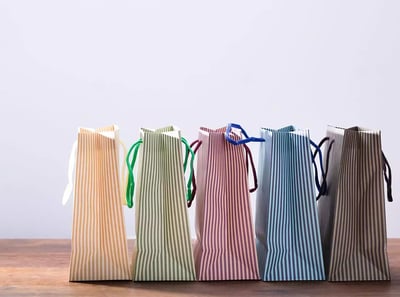 Colourful striped paper shopping bags