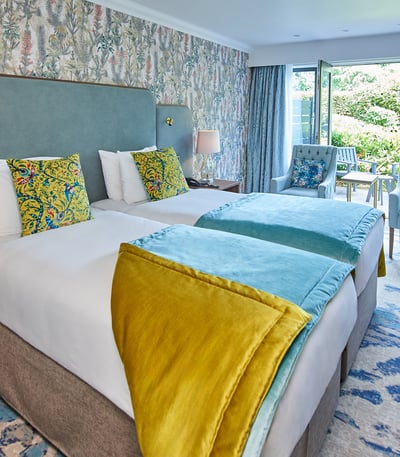 Twin beds in a Signature patio bedroom at Thoresby Hall