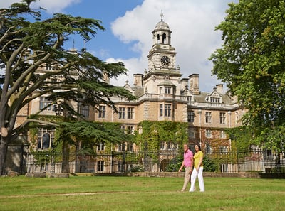 Two guests wandering through the grounds at Thoresby Hall Hotel