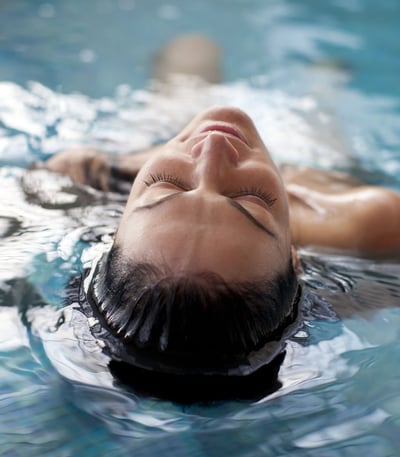 Lady relaxing in a pool