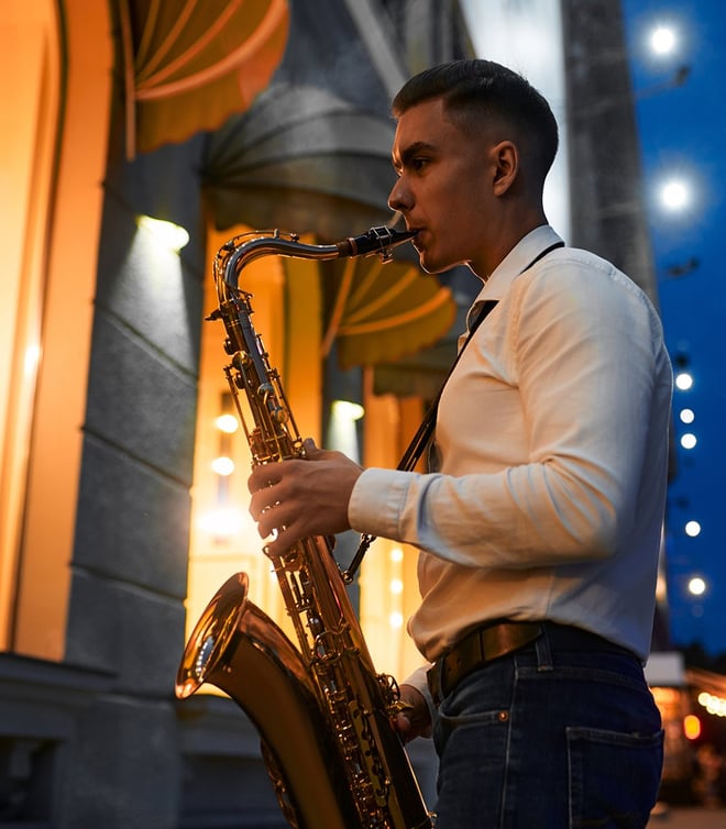 A saxophone player playing in the street