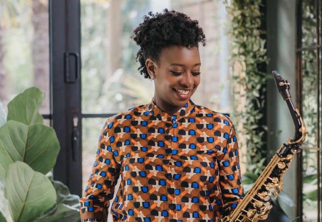 YolanDa Brown holding a saxophone