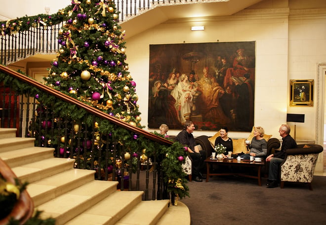 Guests relaxing in the Old House at Cricket St. Thomas during Christmas