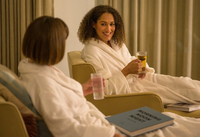 Two ladies relax in the relaxation room at Heythrop Park whilst they wait for their spa treatments