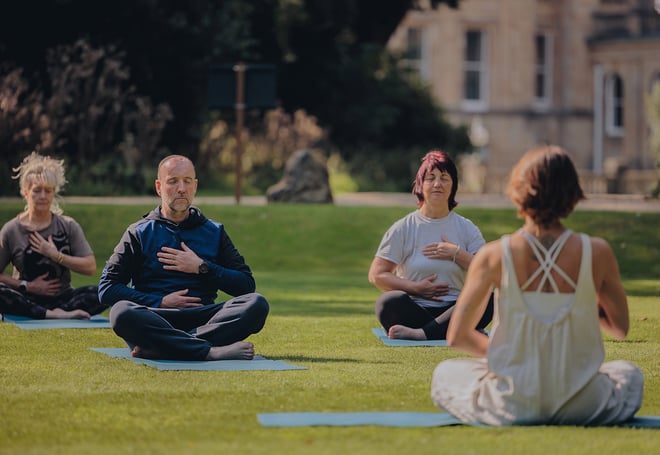 Guests practicing breathwork during a Wellness Retreat at Heythrop Park