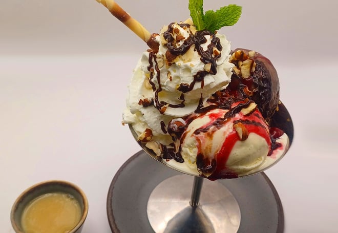 Cherry chocolate sundae: Fruity and fun, featuring sour cherry compote, roasted hazelnuts, and finished off with a decadent Baileys white chocolate sauce over layers of chocolate and vanilla ice cream.