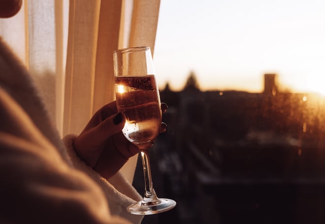 A glass of champagne being enjoyed at sunset during a Valentine's Day weekend break at Heythrop Park Hotel