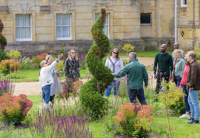 Some guests at Heythrop Park on a guided tour of the garden