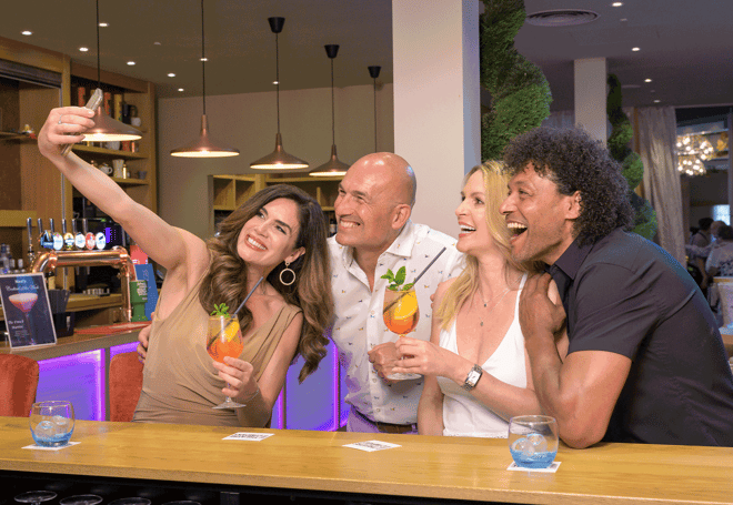 Group of friends drinking and taking a selfie 