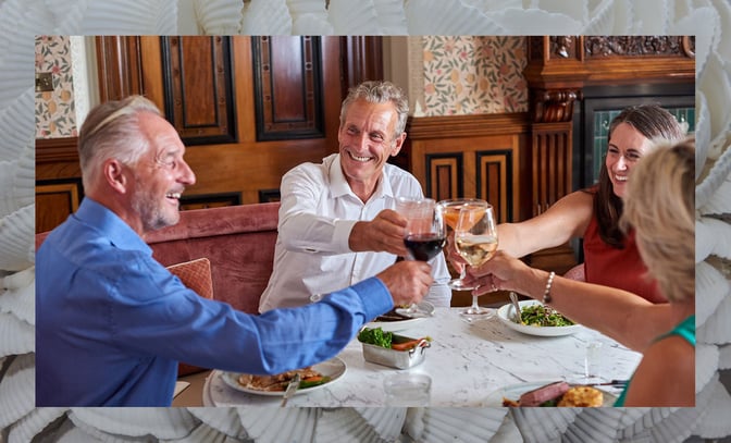 Friends enjoying drinks over dinner