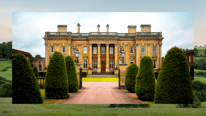 Front of Heythrop Park, with trees on each side of driveway