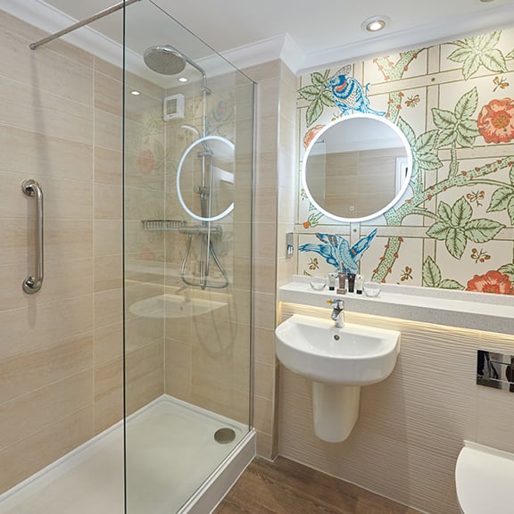 Bathroom featuring a rainforest shower, found within the newly refurbished Signature rooms at Thoresby Hall