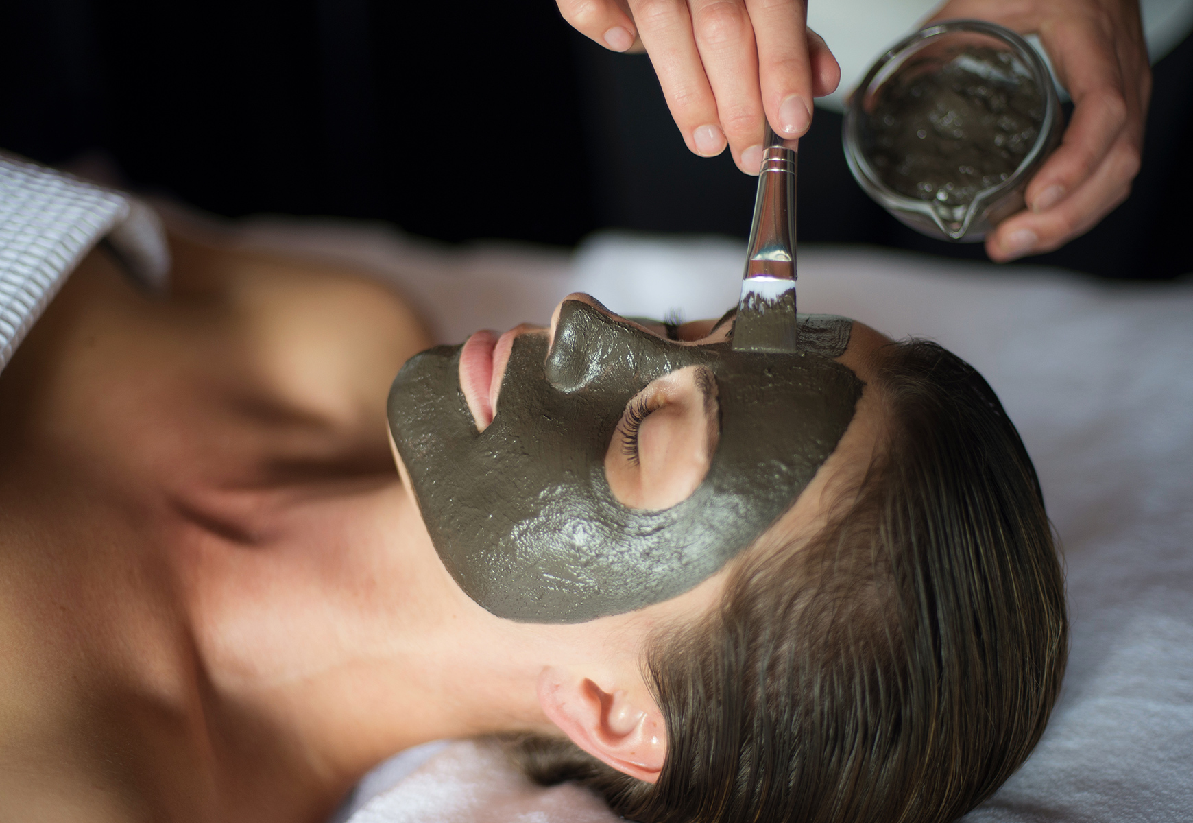 A guest enjoying a facial spa treatment during her spa break